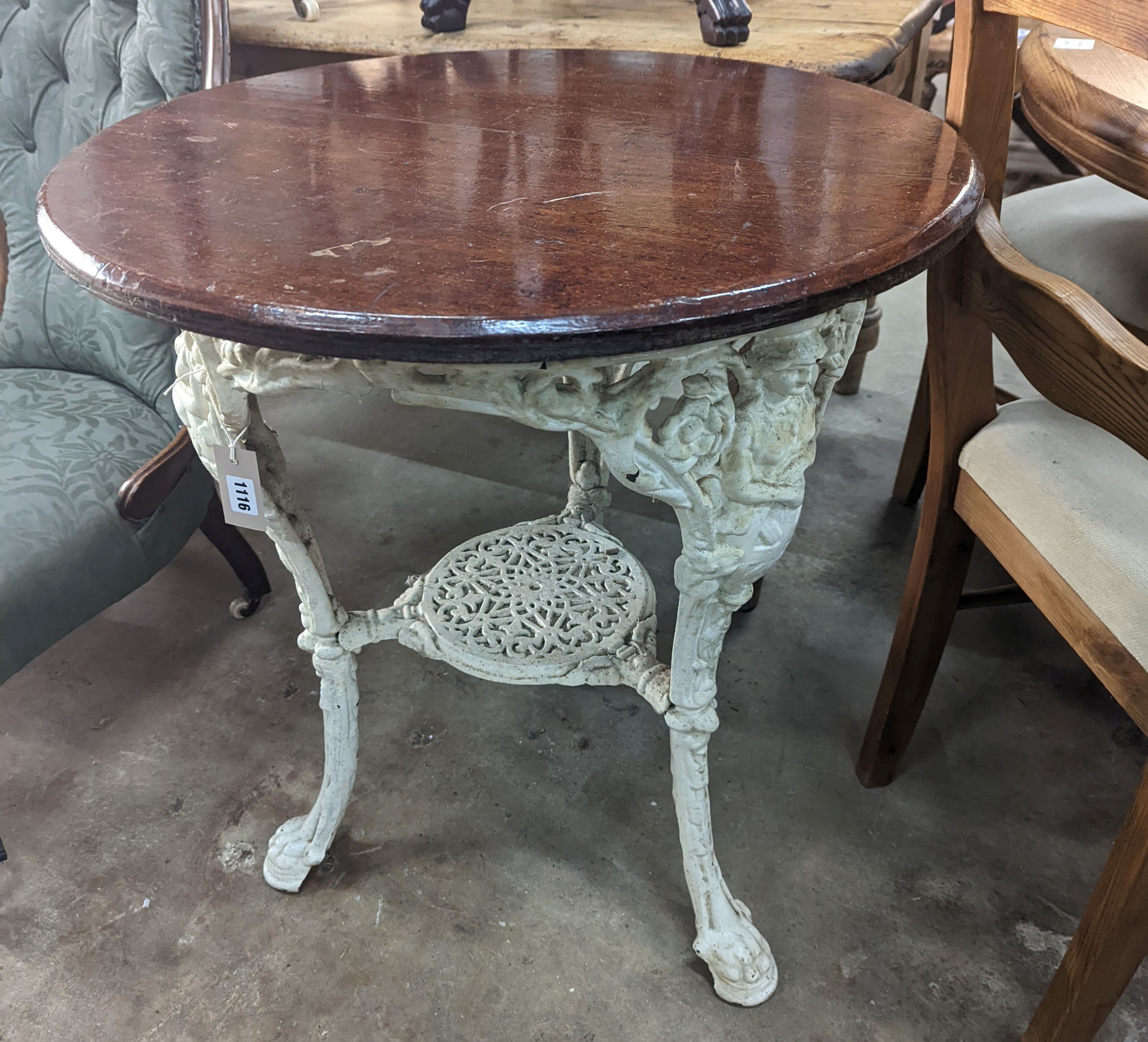 A Victorian white painted cast iron Britannia pub table with circular mahogany top, diameter 66cm, height 74cm